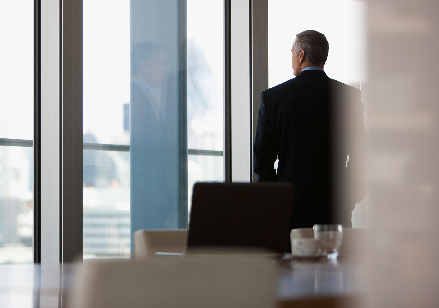 Office worker looking outside window